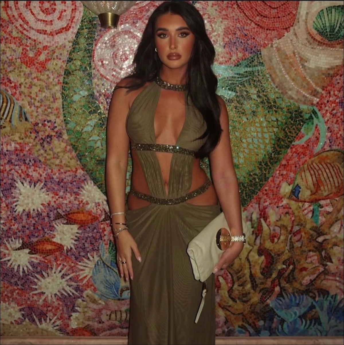 Khaki cut-out backless maxi dress in double layer mesh with hotfix crystals diamante straps and caged back detail. Fastens at hip, bust and front of neck with hook & eyes