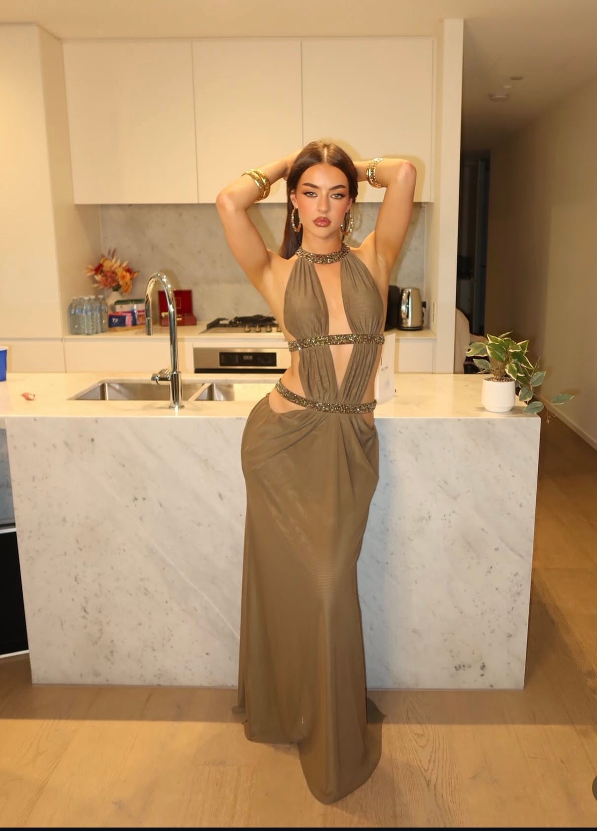 Khaki cut-out backless maxi dress in double layer mesh with hotfix crystals diamante straps and caged back detail. Fastens at hip, bust and front of neck with hook & eyes
