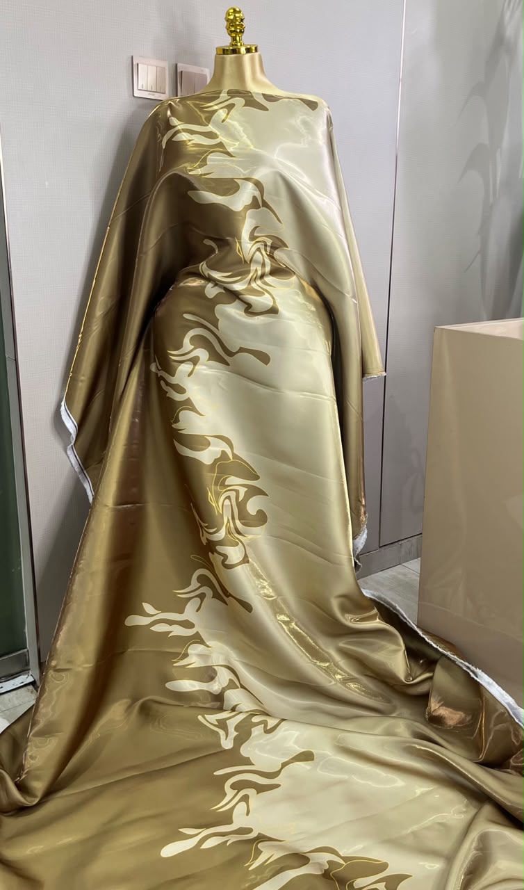 glossy, gold-toned African boubou